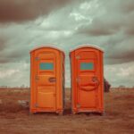 Securing porta potties to prevent damage from high winds